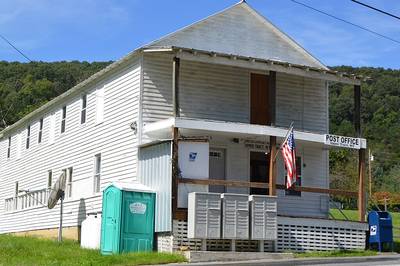Portable toilet beside a small-town post office